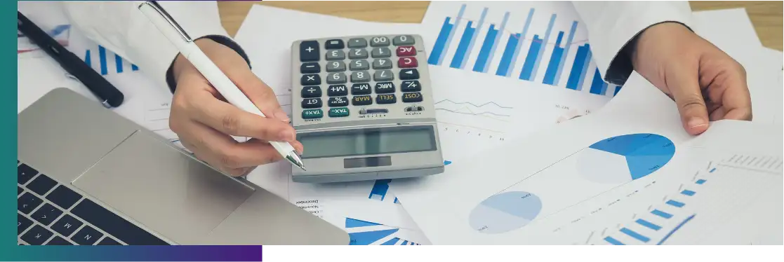 An office working using graphs and a calculator.
