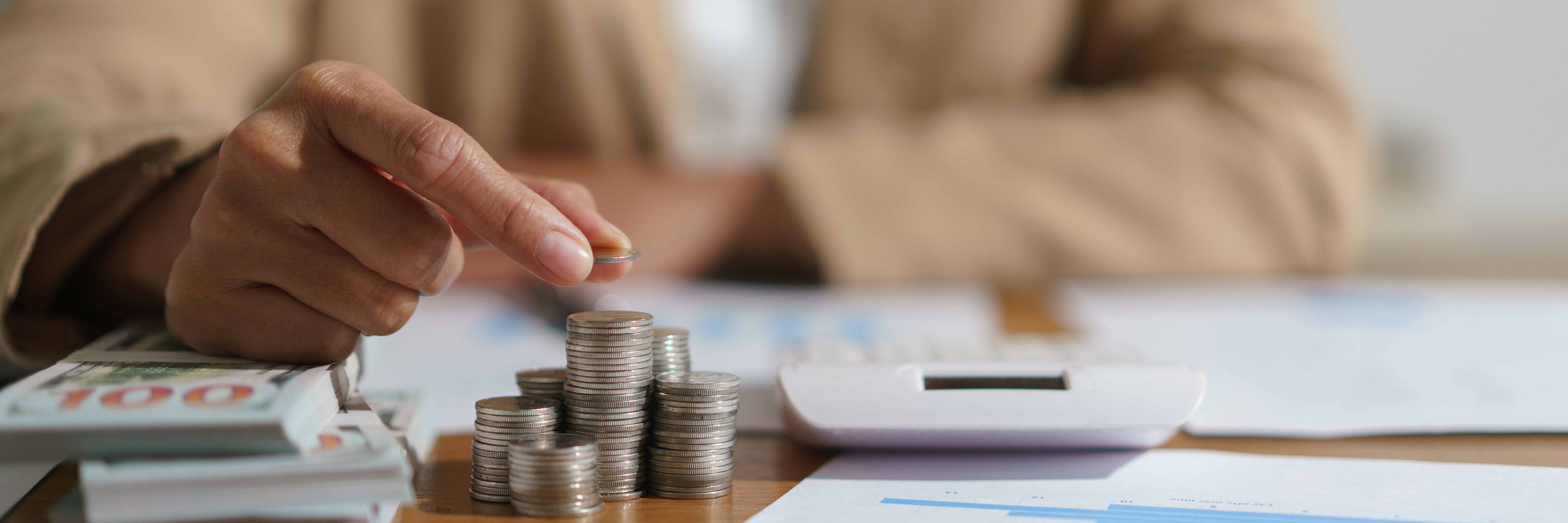 Finance professionals reviewing financial reports and forecasts, representing the benefits of balance sheet software for strategic planning.